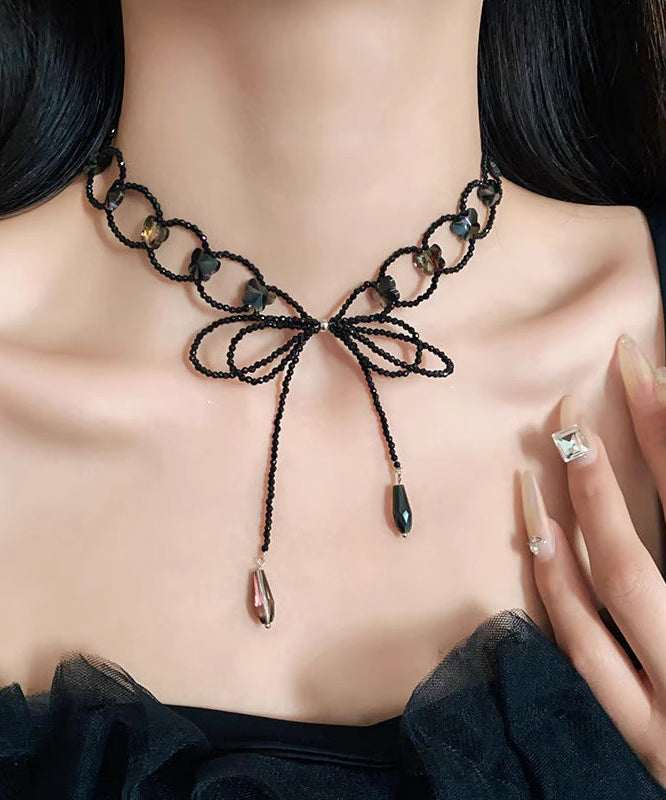 Collier sautoir ajouré à nœud papillon noir tissé - Street-Wave
