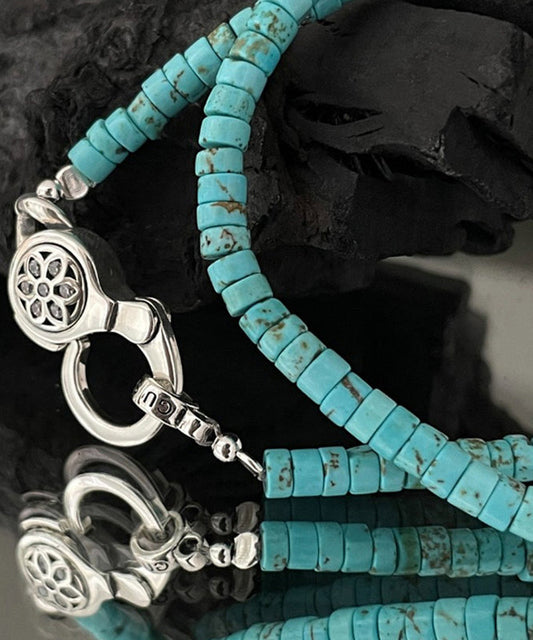 Collier avec pendentif en forme de fleurs de cerisier en acier inoxydable et perles turquoises - Street-Wave