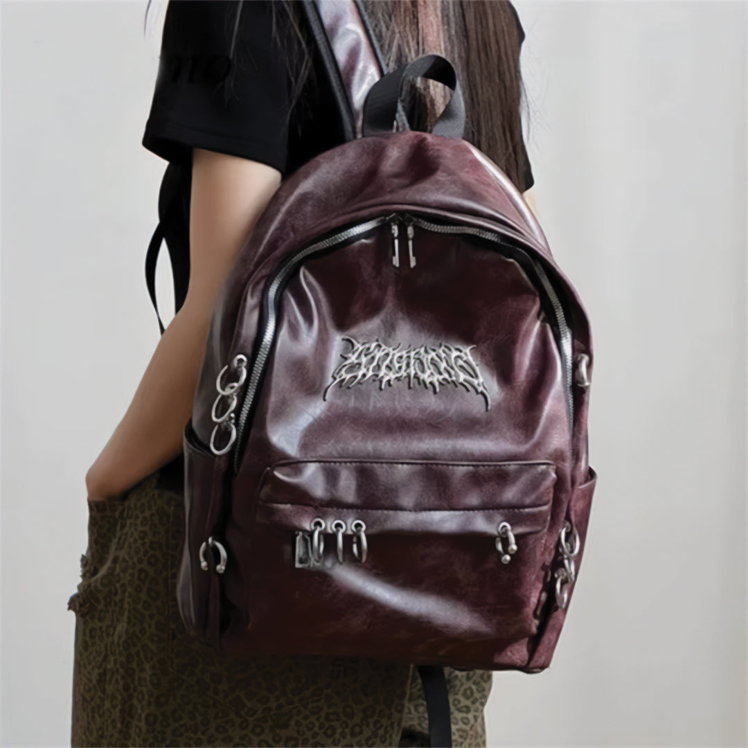 Street-Wave Rebel Chrome Backpack - Vegan Leather With Eye-Catching Metal Circles And Secure Zipper Closures