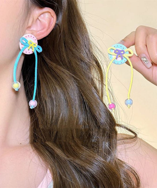 Boucles d'oreilles pendantes à pompon et nœud papillon arc-en-ciel faites à la main - Street-Wave