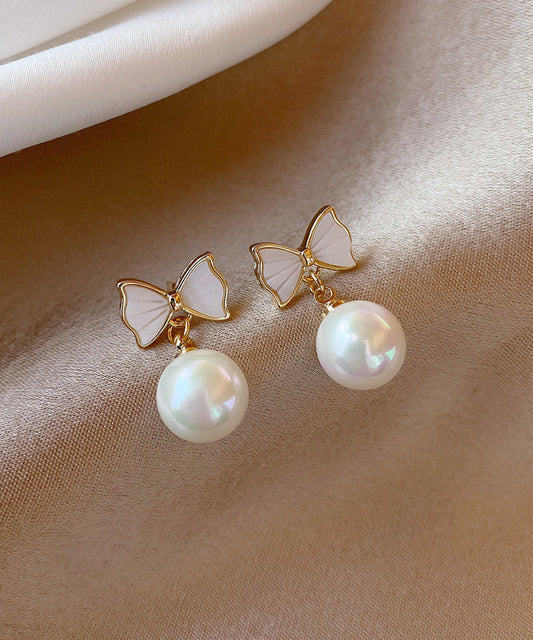 Boucles d'oreilles pendantes élégantes en alliage de cuivre blanc avec nœud en perles de coquillage - Street-Wave