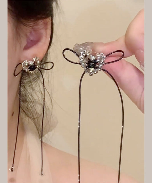 Boucles d'oreilles pendantes simples en cuivre noir avec nœud d'amour et pompon - Street-Wave