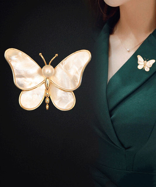 Broches papillon en nacre et cuivre surdoré couleur champagne Vogue - Street-Wave