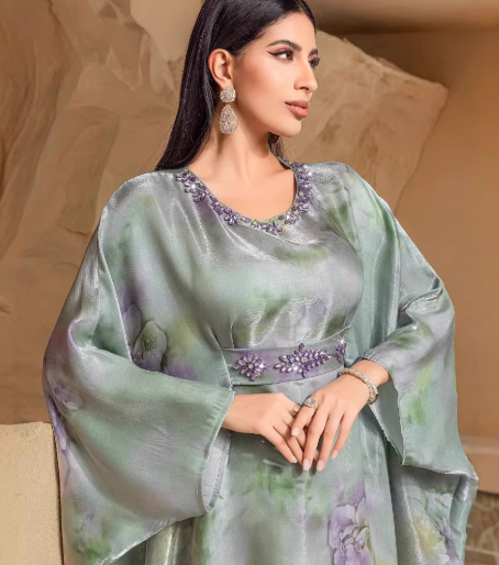 Elegant holiday dress with green fruit print and batwing sleeves